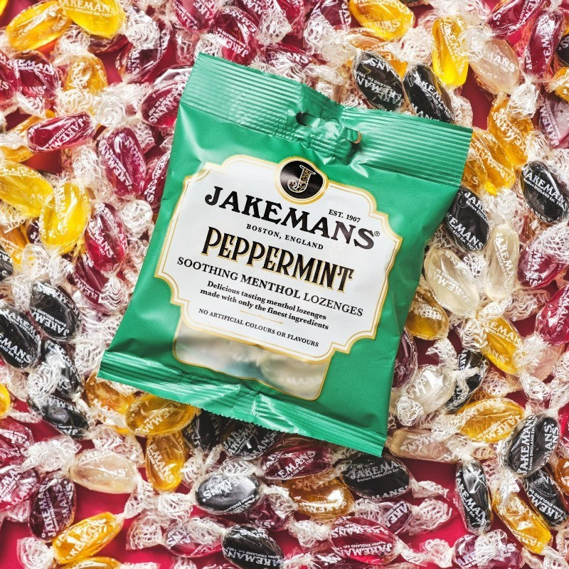 Jakemans Peppermint Menthol Lozenges bag packaging peppermint flavour 12 x 73g serving suggestion image