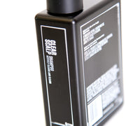 Side image: Uppercut Deluxe Strength and Restore Shampoo 240ml bottle mandarin patchouli fragrance packaging