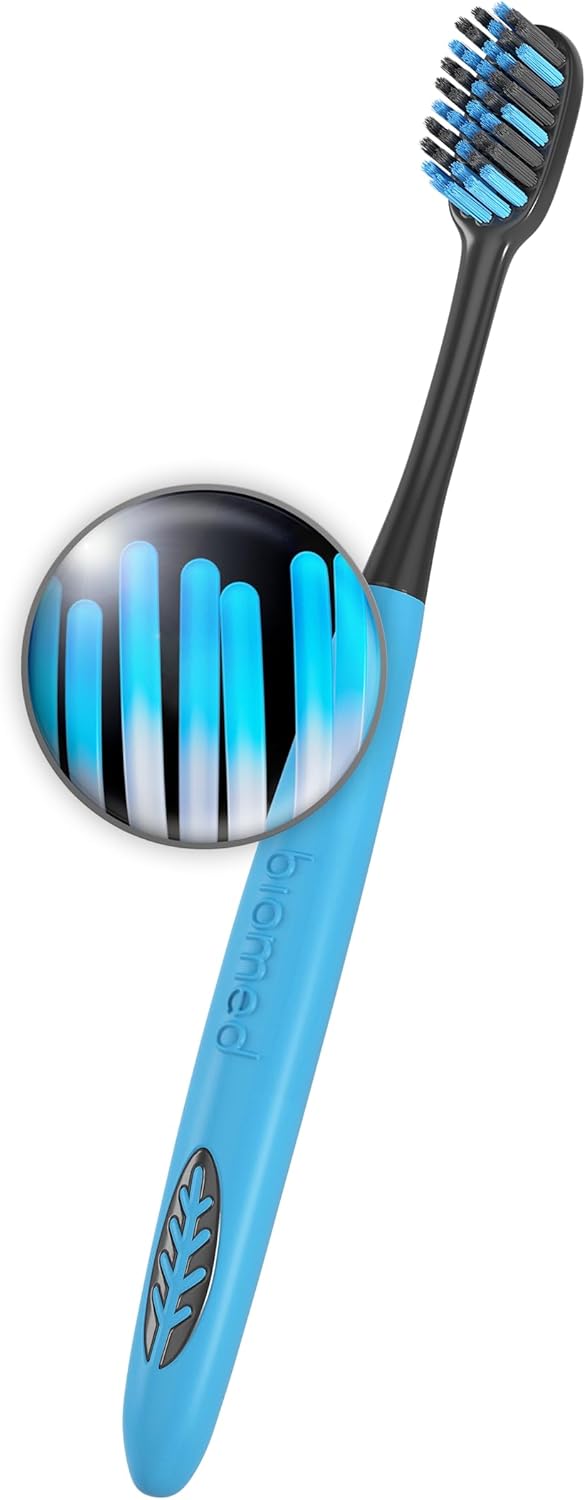 BIOMED Black Charcoal Toothbrush, medium bristles, on a clean background.