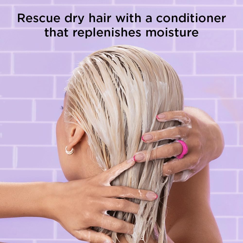 Noughty conditioner being poured onto hand with hair lathered.
