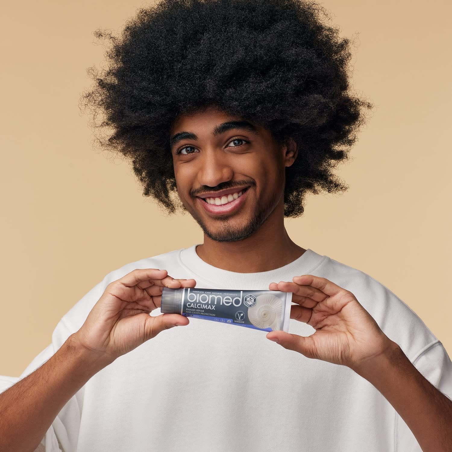 BIOMED Calcimax 97% Natural Toothpaste 100g used during a daily oral care routine