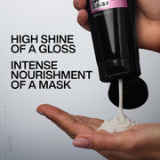 Redken Hair Mask being squeezed from a tube.
