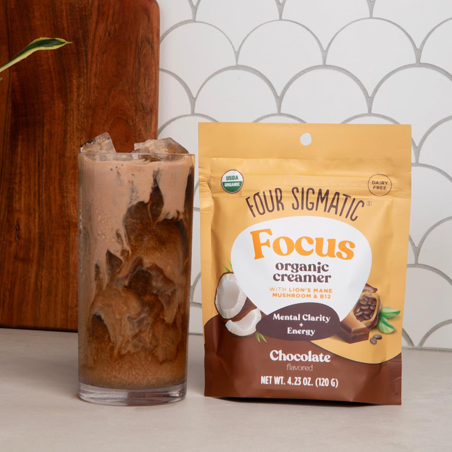 How to Use: Chocolate creamer being frothed into a glass of coffee.
