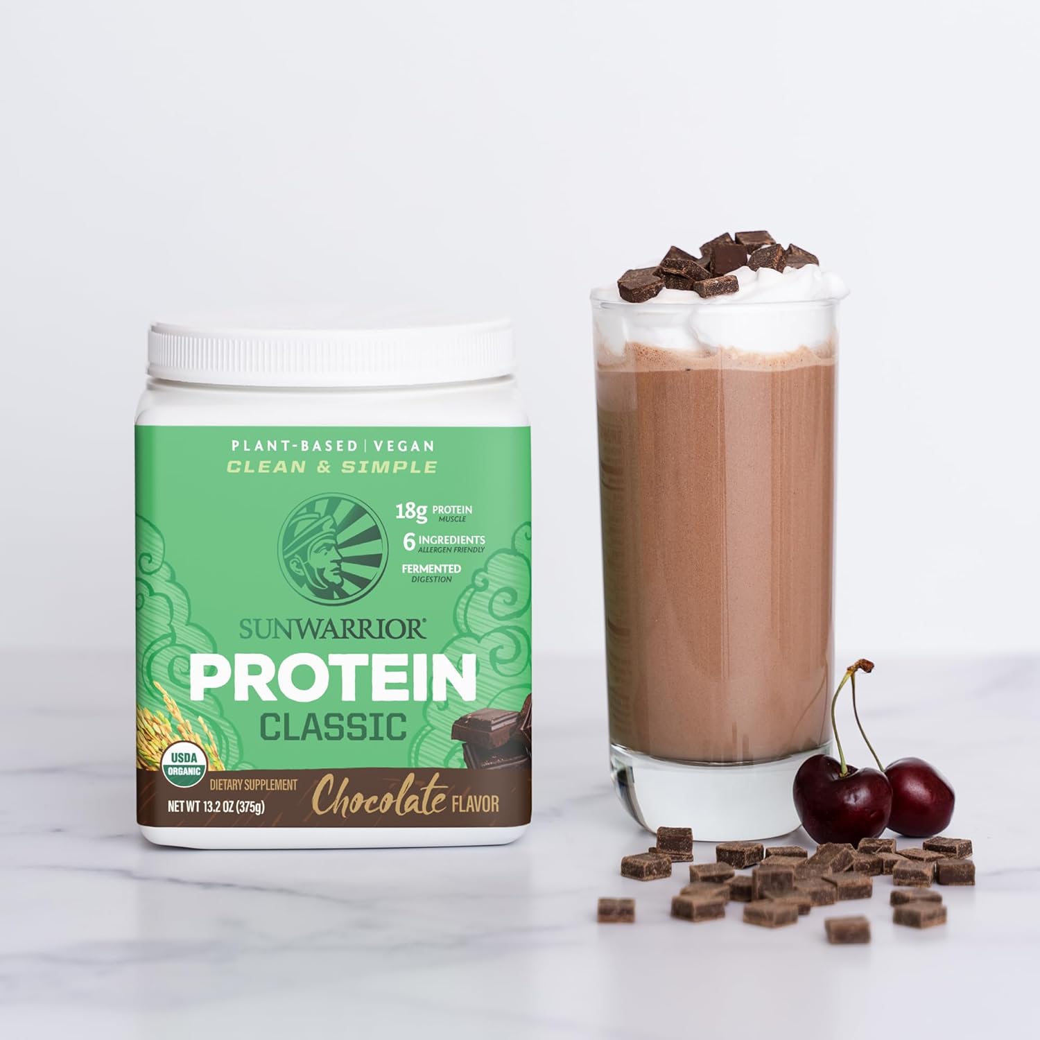 Chocolate rice protein powder being blended into a shake.