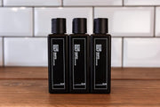 Lifestyle/use image: Uppercut Deluxe Clear Scalp Shampoo 3 240ml men hair care routine