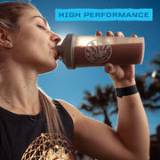 Sunwarrior chocolate protein powder being mixed in a shaker bottle.