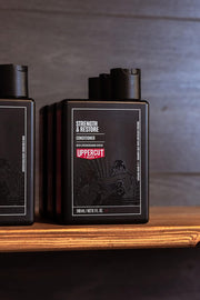 Lifestyle/use image: Uppercut Deluxe Strength and Restore Conditioner 240ml men hair care routine