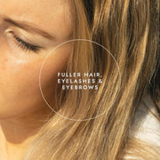 Close-up of a person with blonde hair, eyelashes, and eyebrows with text overlay.