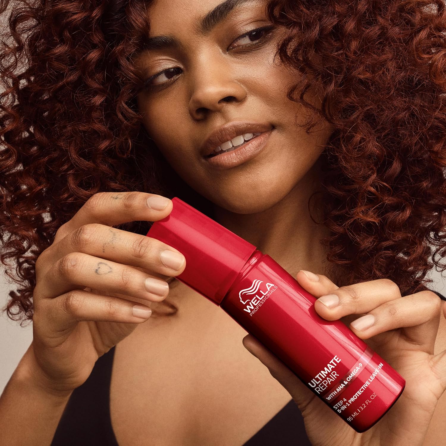 Wella Professionals Ultimate Repair Step 4 leave-in lotion applied to hair lengths 95ml