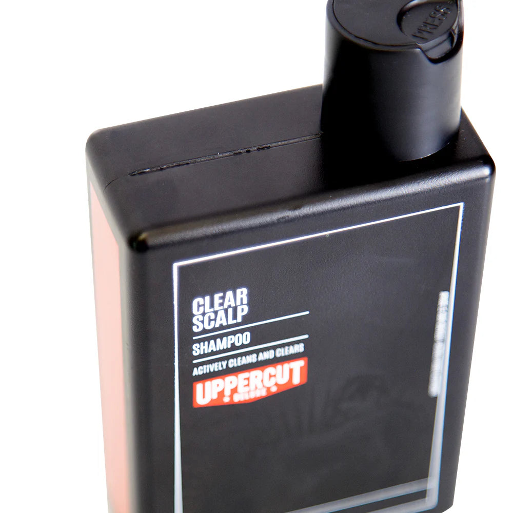 Side image: Uppercut Deluxe Clear Scalp Shampoo 240ml bottle fresh woods pepper fragrance packaging