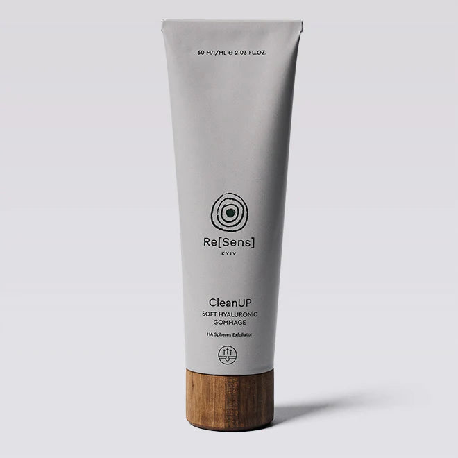 Tube of Re[Sens] CleanUP soft hyaluronic gommage with wooden base on a light gray background